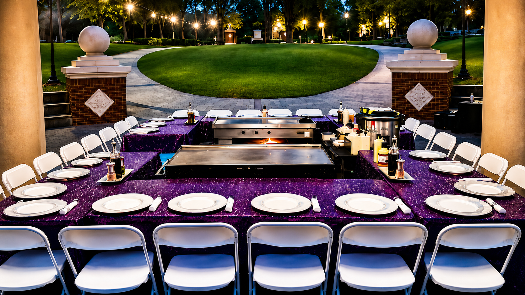 Hibachi setup with purple sequin linens at evening park venue